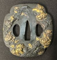 Japanese Sword Tsuba in bronze, unsigned, featuring Komainu Lion-dogs and Flowers, size 73mm x 68mm.
