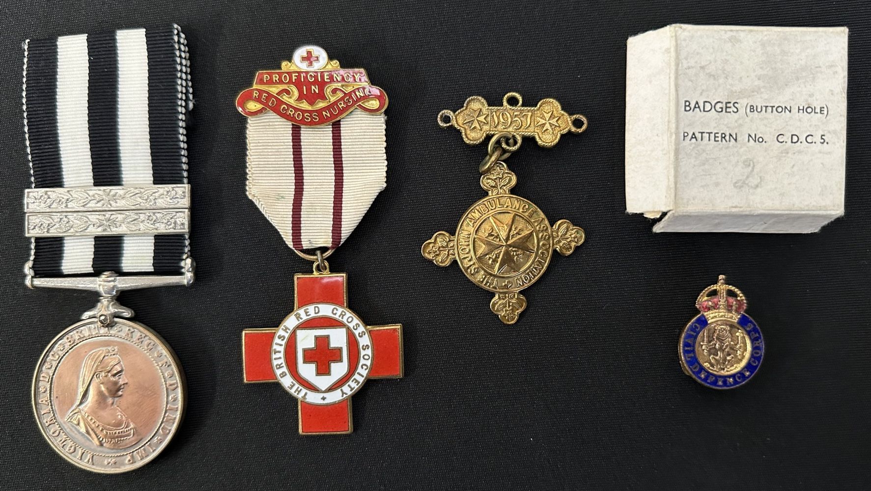 Service Medal of the Order of St John complete with ribbon, un-named: British Red Cross Medal to