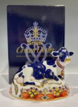 A Royal Crown Derby paperweight, Friesian Cow 'Buttercup', 21st anniversary heptagonal gold stopper,