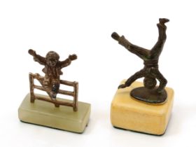 A Continental cabinet bronze, of a young acrobat, Sienna marble base, 8cm high; a silver cabinet