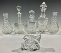 A Waterford Crystal Tramore decanter; other cut glass decanters; a pair of cut glass carafes; etc (