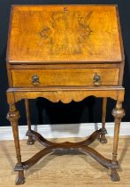 A William and Mary style mahogany and walnut veneered bureau on stand, fall front, cross banded