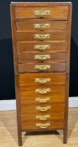 A set of mahogany drawers, the cross banded caddy top above two sets of six graduated dovetailed