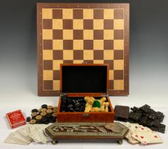 A chess set and board; other games, dominoes, cribbage board and counters, draughts, playing