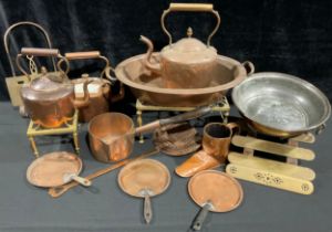 A 19th century copper colander, brass suspension loop, 33cm diameter; a copper two handled pan, 53cm