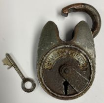 An early 20th century Chubb of London Battleship padlock, with key, 9cm