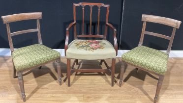 A Sheraton Revival mahogany carver chair, the back with three carved fluted columns, tapering