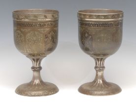 A pair of large Indian bidri pedestal goblets, each chased with stylised lotus, 21.5cm high