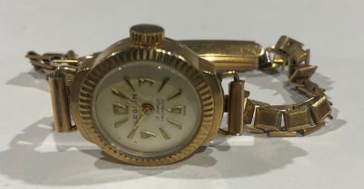 A lady's 9ct gold Legion watch, Champagne dial with Arabic and baton indicators, the case interior