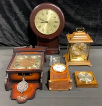 A mahogany inlaid dome shaped mantel clock; a wall clock; a reproduction bracket clock; other