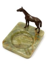 An early 20th century Austrian cold painted bronze, of a horse, mounted on a green onyx dish, 12.5cm