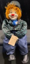 A Hobo Designs 'Rascal' porcelain headed doll, as a clown, posable limbs, labelled, late 20th