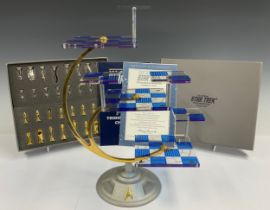 A Franklin Mint Official Star Trek Tridimensional Chess Set, silver plated and gold plated playing