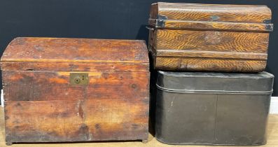 A 19th century pine domed top trunk or chest, 73cm wide over handles; a rounded rectangular black