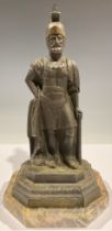 A 19th century bronze sash window stop, cast as a Roman centurion, octagonal marble base, 28cm high