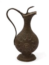 A Kashmiri copper ewer, chased in the Persian taste with lotus and scrolling foliage, hinged