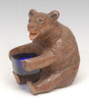 A Black Forest novelty table vesta, carved as a bear, 11cm high
