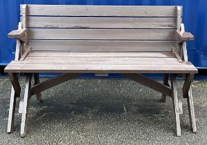 A painted hardwood metamorphic combination garden bench and picnic table, 86cm high (bench), 141.5cm