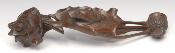 A Chinese hardwood ruyi, carved as a lotus, the pad with the toad Jin Chan, 37.5cm long