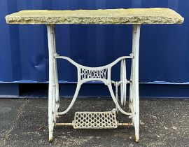 A cast iron and stone garden or orangery table, repurposed from a treadle sewing machine base, 77.