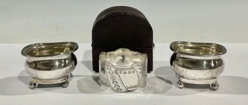 A pair of Victorian boat shaped silver salts, ball feet, Birmingham 1897; a Victorian Aesthetic