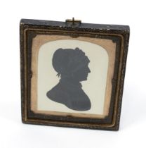 English School (19th century), a silhouette, of a lady wearing a lace cap, bust length, watercolour,