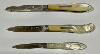 A Victorian silver and mother of pearl folding pocket fruit knife, Sheffield 1862; others, Sheffield