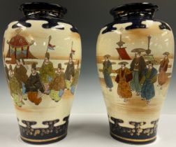 A pair of Japanese export ware decorative satsuma style baluster vases, printed and painted with