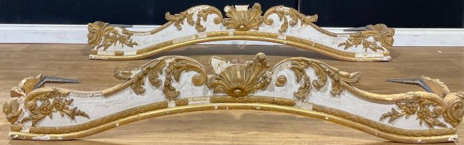 A pair of Italian Rococo Revival parcel-gilt pelmets, the largest 178cm wide, the other 167cm