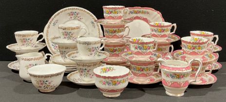 A Crown Staffordshire tea service for ten, Lyric Tunis Pink, comprising cake plate, side plates,