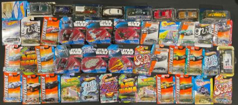 A Star Wars Mattel HotWheels model, Millenium Falcon in original blister pack, sealed; others