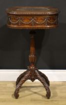 An Adam Revival mahogany work table, hinged top above a deep frieze carved and applied with ribbon-