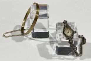 A silver marcasite lady's cocktail watch, marked 925; a gold plated bangle (2)