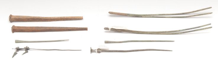Antiquities - an early Iron Age garment or hair pin, 16cm long, c.600BC; others, Tang Dynasty China;
