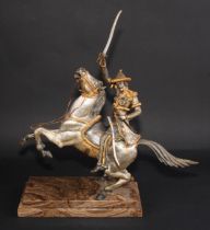 Continental School (20th century), a parcel-gilt and silvered bronze, of a cavalry officer on
