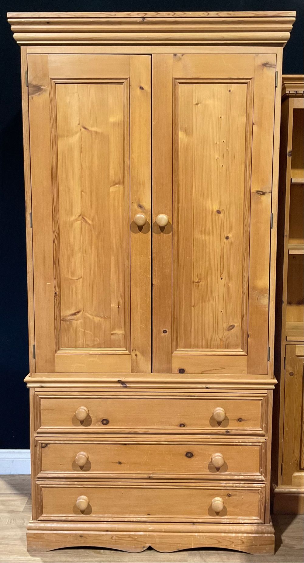 A pine double wardrobe with three long drawers, 198cm high, 98cm wide, 62cm deep; a pine bookcase - Image 2 of 4