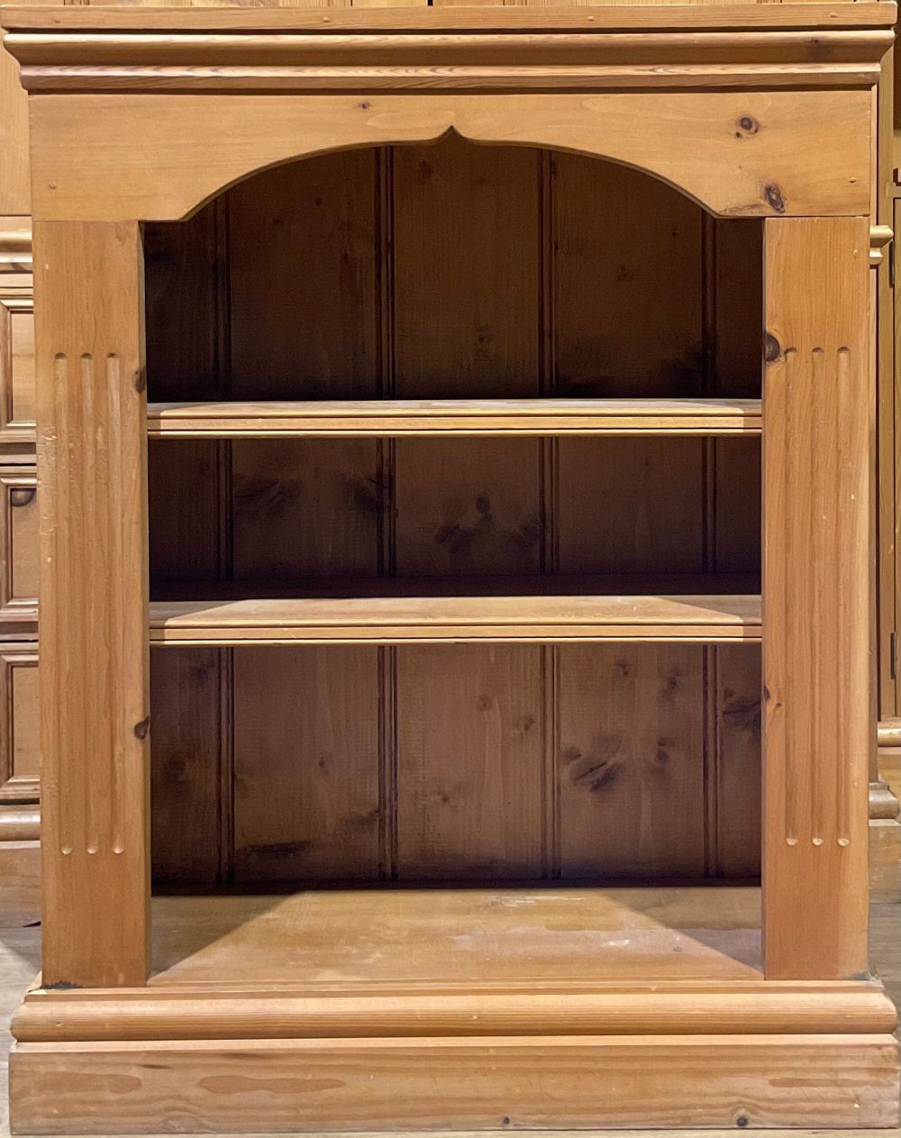 A pine double wardrobe with three long drawers, 198cm high, 98cm wide, 62cm deep; a pine bookcase - Image 3 of 4