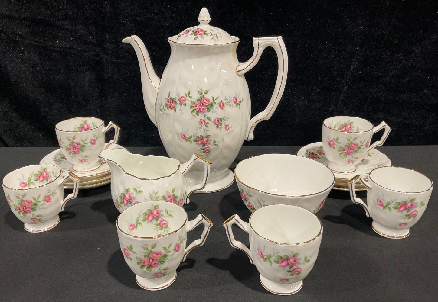 An Aynsley Grotto Rose pattern coffee pot, cream jug and sugar bowl, six coffee cups and saucers