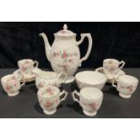 An Aynsley Grotto Rose pattern coffee pot, cream jug and sugar bowl, six coffee cups and saucers