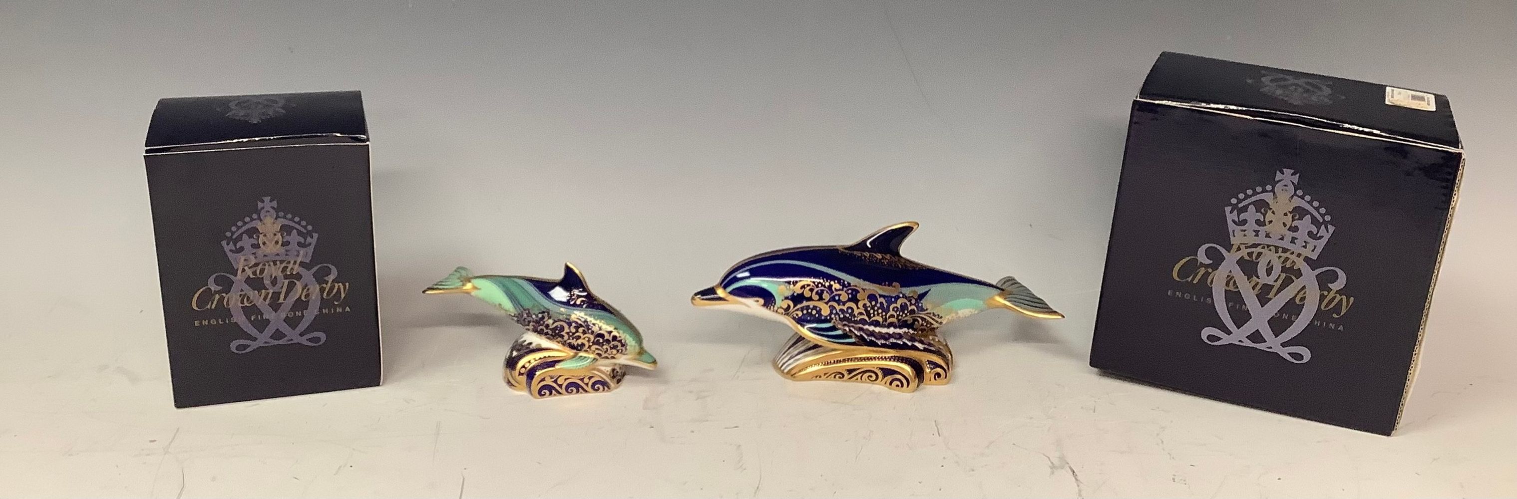 A pair of Royal Crown Derby paperweights, Bottlenose Dolphin and Baby Bottlenose Dolphin, both