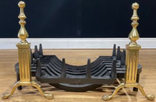 An Adam design brass and cast iron fire basket, the andirons 36cm high, 52cm wide including andirons