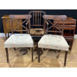 An oak provincial armchair, rush seat, fluted spindles, 84cm high; a pair of mahogany side chairs,