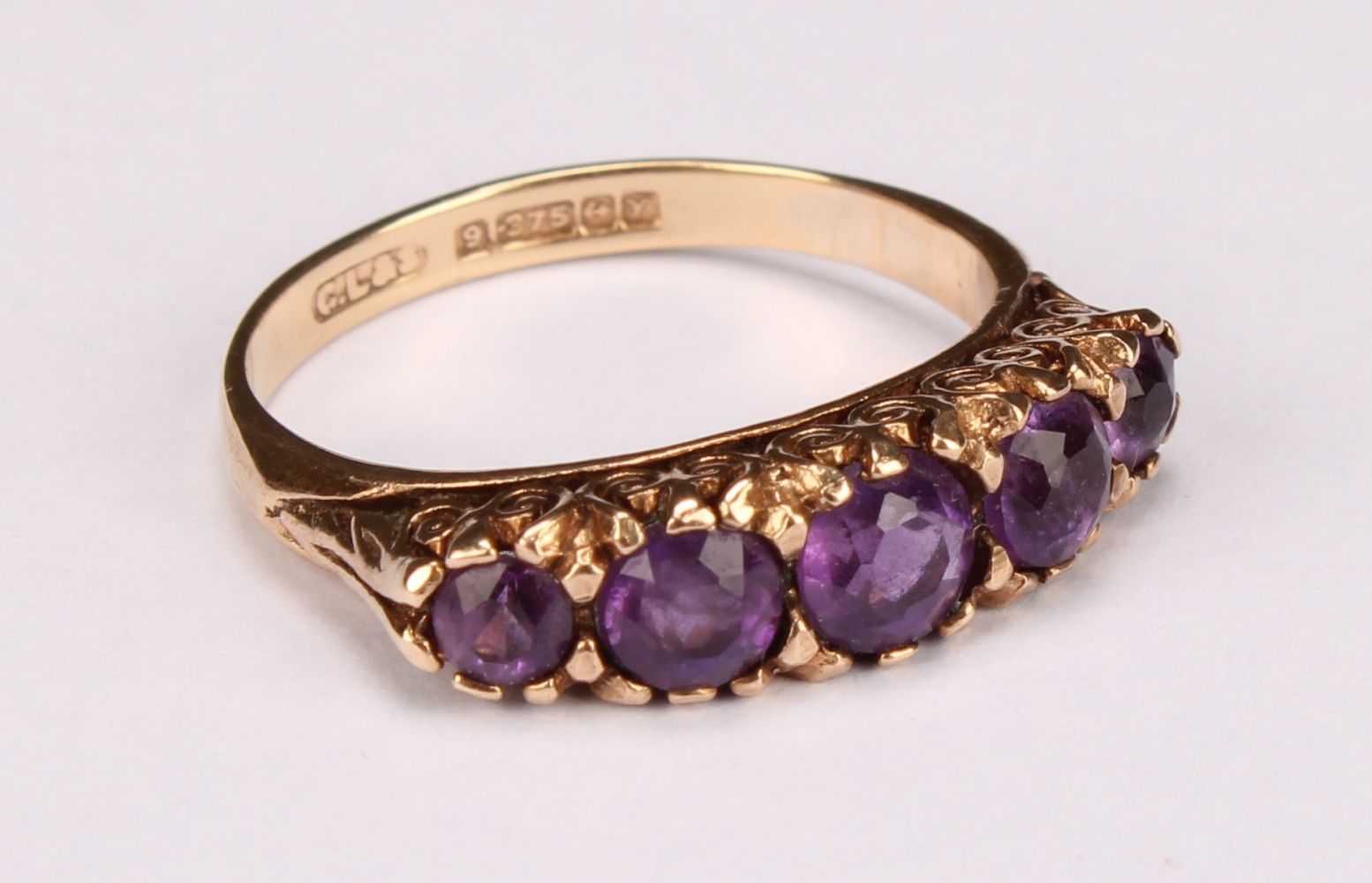 A five stone amethyst and 9ct gold ring, the graduated round fact cut stones claw set, size L, 2.93g - Image 2 of 7
