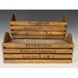 A pair of wooden troughs with metal inserts, each advertising Harrods, Knightsbridge, London, S.W.1,