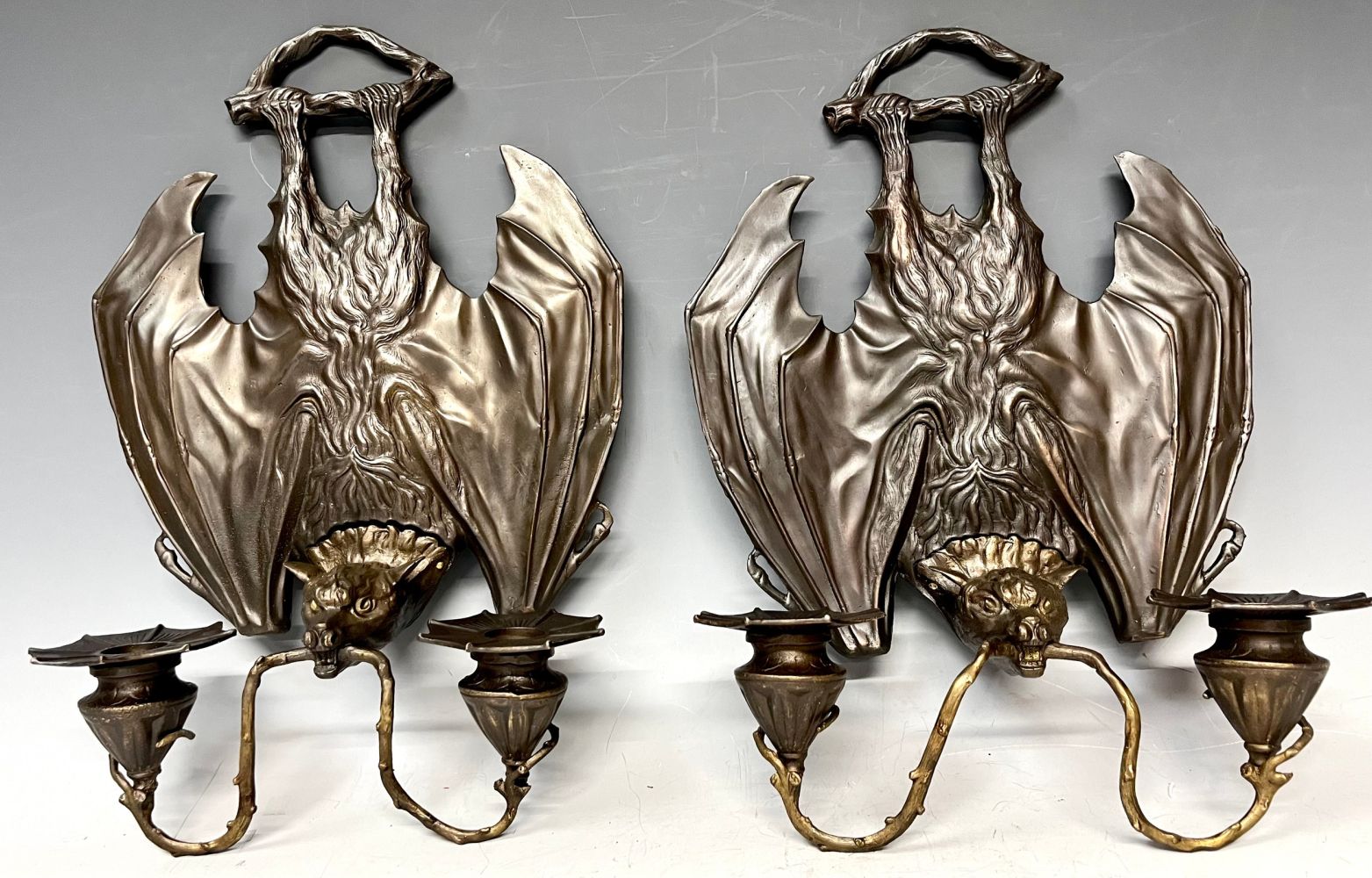 Interior Design - a pair of contemporary bronzed metal two branch wall sconces, each modelled as a
