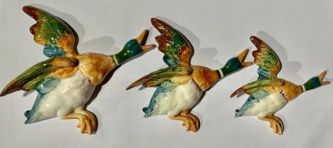 A set of three Beswick wall mounted graduated Flying Teal Ducks, nos 596-1, 596-2, and 596-3,