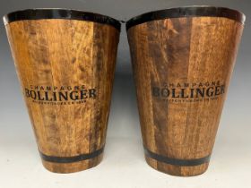 A pair of tall wooden wine buckets, marked 'Champagne Bollinger, Maison Fondée en 1829', 40cm high