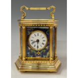 A French lacquered brass hexagonal carriage clock, applied with champlevé panels, swing handle,