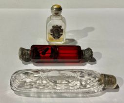 A Georgian cut glass scent. silver top; a scent with armorial; a ruby glass scent, all with silver