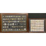 A Military badge collection; a cigarete card medal set